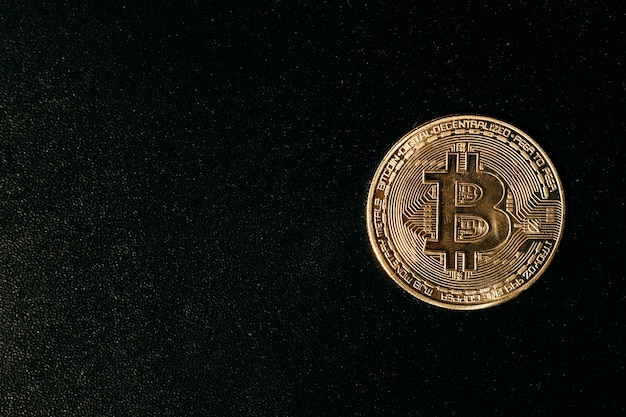 Bitcoin Golden bitcoin isolated on dark background