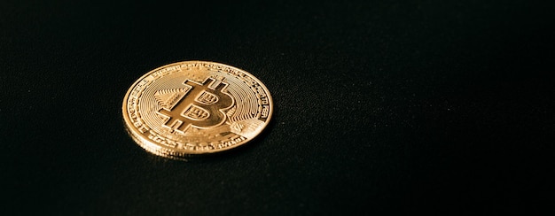 Bitcoin Golden bitcoin isolated on dark background