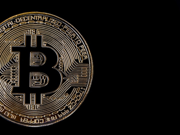 Bitcoin technology dark background. Close-up golden bitcoin on black background with copy space, cryptocurrency investment concept. Digital future coin currency financial background.