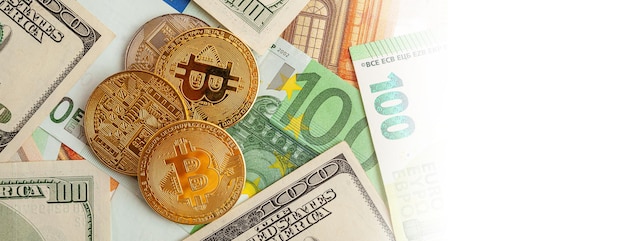 Bitcoins on a texture background of euro and dollars panorama