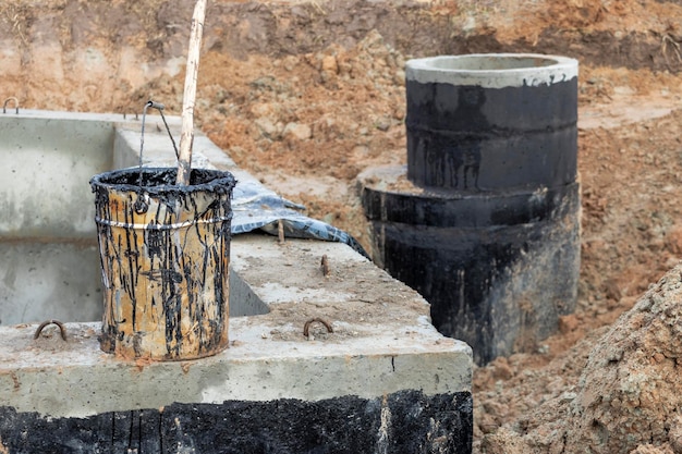 Bituminous waterproofing of wells for water supply and sewerage at a construction site Thermal unit for the distribution of water and sewerage in the city