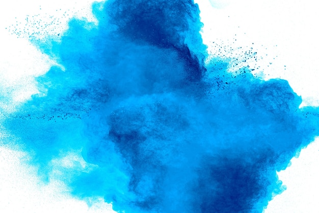 Bizarre forms of blue powder explosion cloud on white background.Launched blue dust particles splashing.