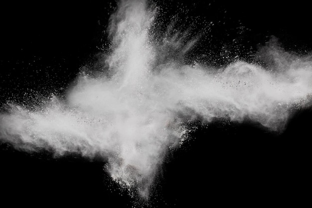 Bizarre forms of  white powder explosion cloud against dark background