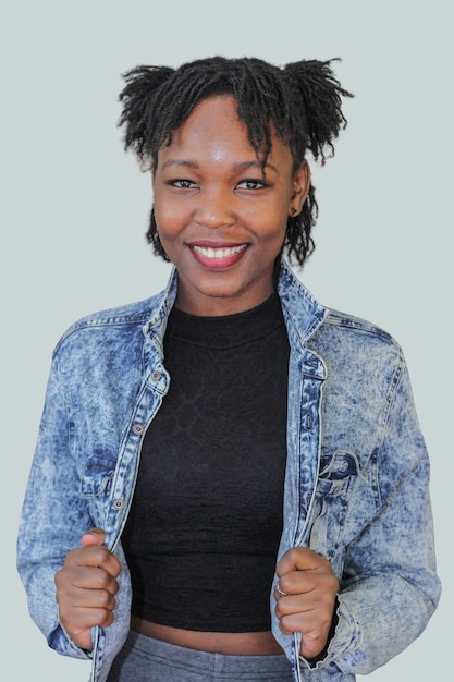 black african young woman smiling and holding a jacket