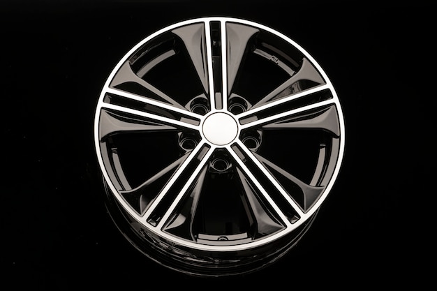 Black alloy wheel on dark background close up