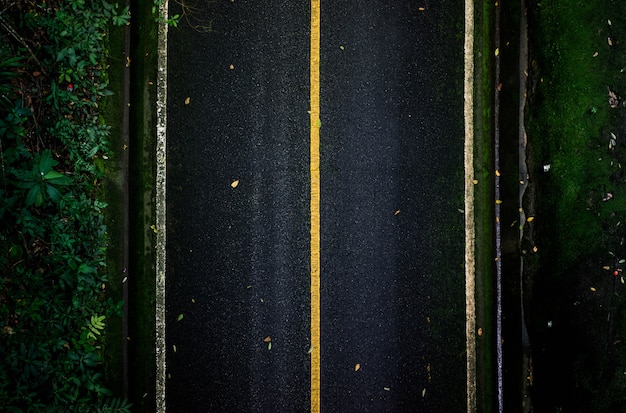 Black asphalt road that looks from top view With straight lines