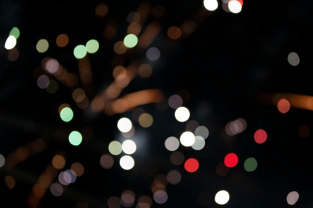 On a black background bokeh from explosions of colorful fireworks