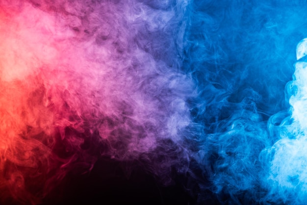 Black background with smoke colours Cloud of smoke with different colours