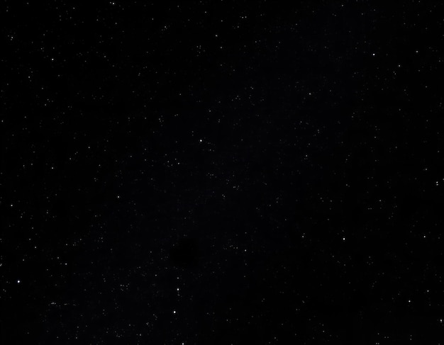 a black background with the stars in the sky