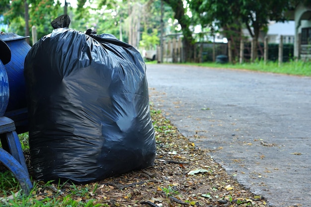 Black bags of garbage placed on the street for sale