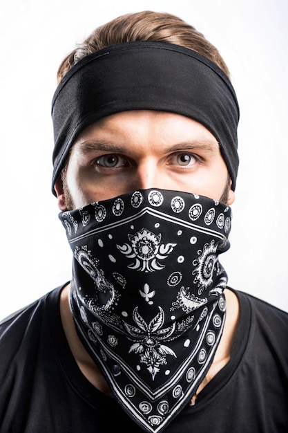 Photo black bandana with a white pattern accessory for concerts rockers bikers rappers hiphop metalheads punk rock rap an element of clothing handkerchief for the face of gangsters