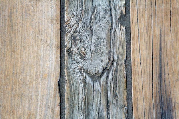 Black beach sand and wooden floor