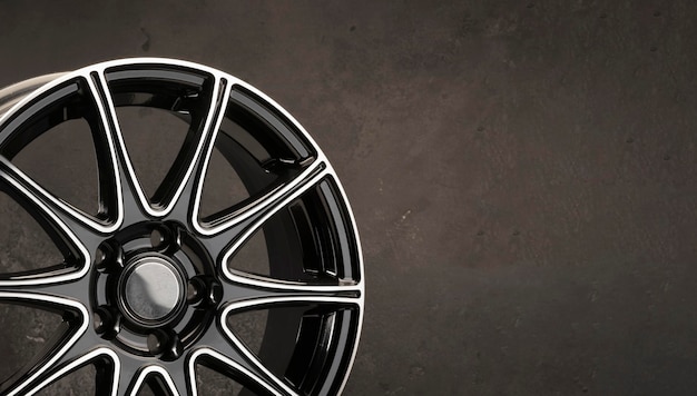 Black beautiful stylish alloy wheel detail on a dark background copy space