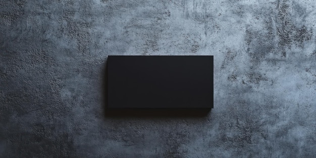 Photo a black box on a grey wall with a blank black box on the left side