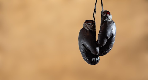 Black boxing gloves hanging