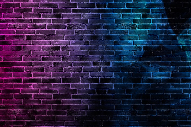 Black brick wall background with neon and glowing lights.