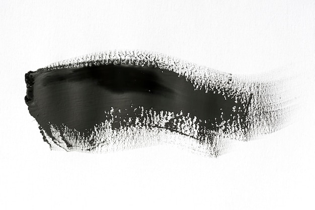 Black brush stroke on white background