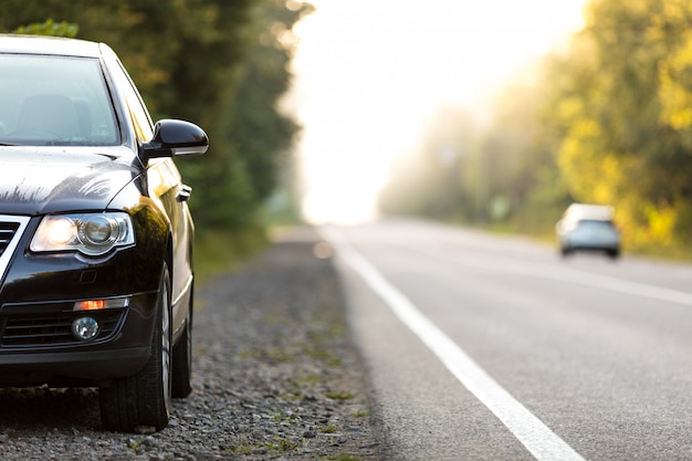 Black car on asphalt road