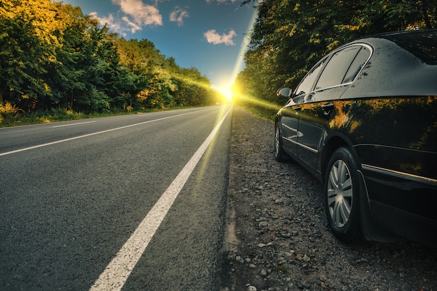 Black car on asphalt road