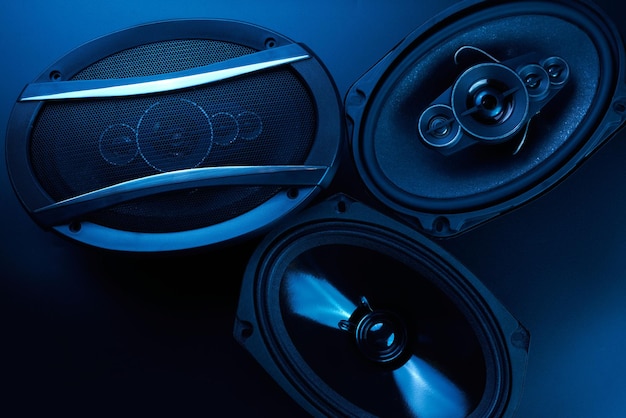 Black car sound speakers closeup on a black background audio system hard bass subwoofer