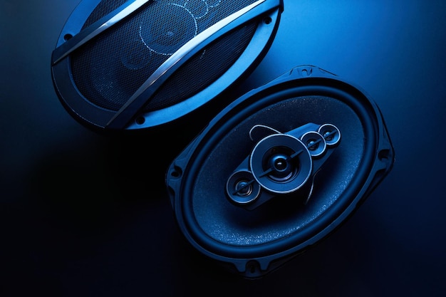 Black car sound speakers closeup on a black background audio system hard bass subwoofer