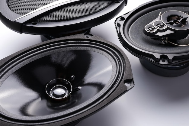 Black car sound speakers closeup on a white background audio system hard bass subwoofer