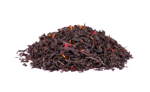 Black Ceylon tea with flower petals and bergamot, isolated on white background.