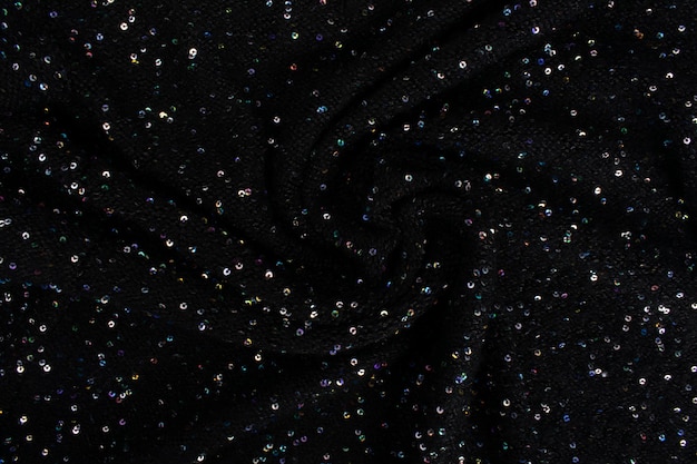 Black cloth paillettes. Background texture, pattern