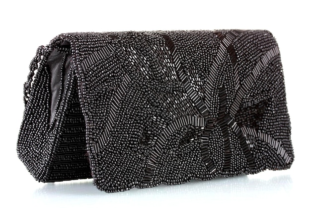 Black clutch embroidered with beads isolated on white