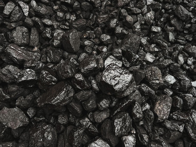 Photo black coal rocks surface for heating house use