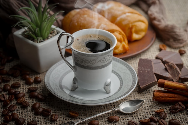 Black coffee beans on an old background