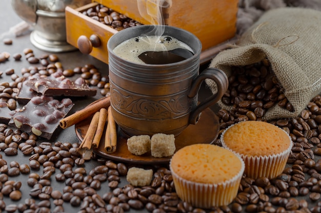 Black coffee beans on an old background