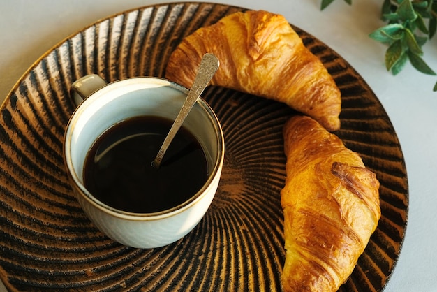 Black coffee and fresh pastries