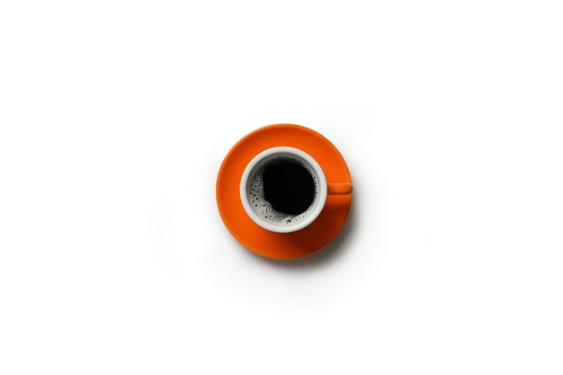 Black coffee in an orange cup and saucer isolated on white background with clipping path inside