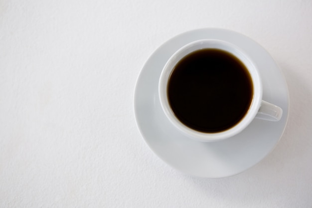 Black coffee served in white cup