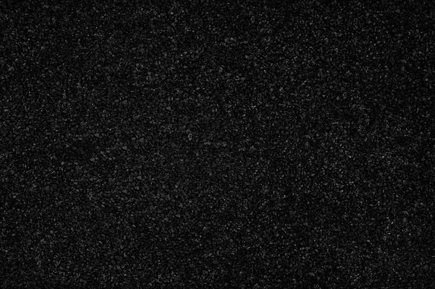 Black color granules texture background