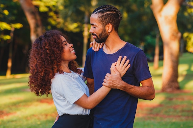 Black couple in the park in love. Passionate couple of lovers