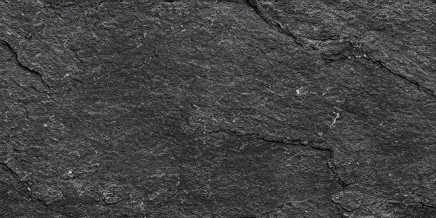 Black or dark gray rough grainy stone texture background