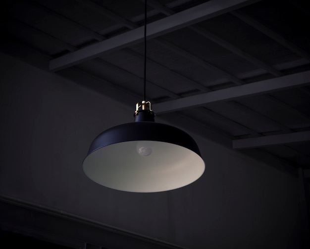 Black decorative lamp hanging from the ceiling decoration in hotel