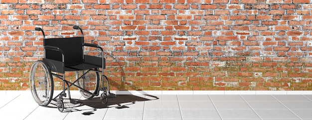 Black disability wheelchair near brick wall