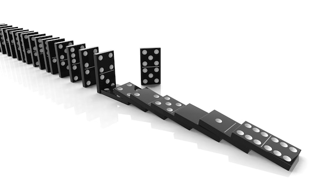 Black domino tiles falling in a row with some standing isolated on white