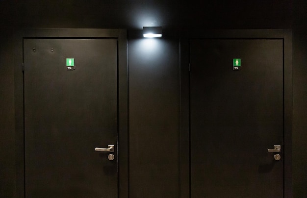 Black door in the dressing room in a nightclub