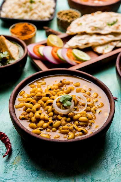 Black Eyed Kidney Beans Curry served in a bowl with Naan and rice