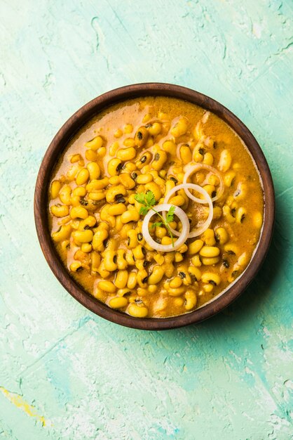 Black Eyed Kidney Beans Curry served in a bowl with Naan and rice