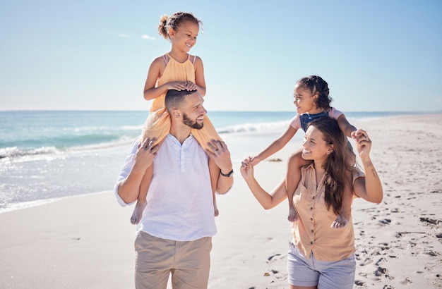 Black family happy and beach summer vacation with quality time with children by the sea Happiness of mother man and kids with a smile walking together by the ocean water waves and blue sky