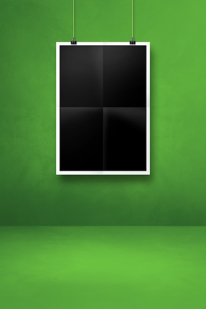 Black folded poster hanging on a green wall with clips. Blank mockup template