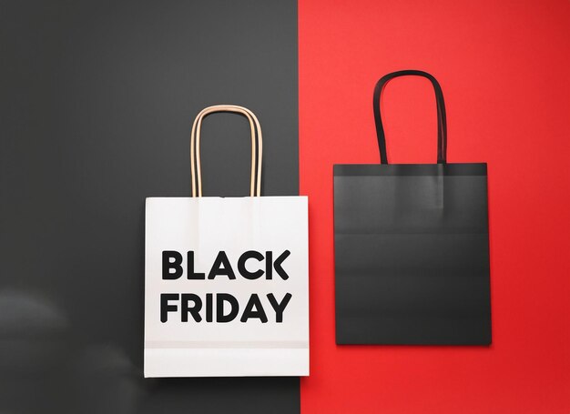 Black Friday shopping bags on red and black background with copy space