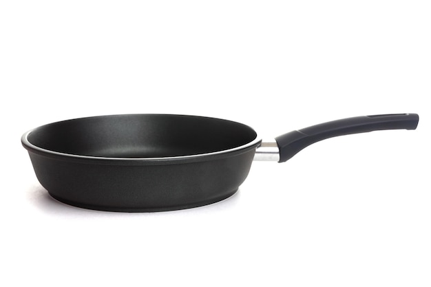 Black frying pan with black handle and nonstick coating on a white background