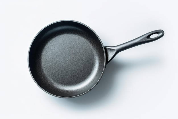 A black frying pan with a black handle and a white background.