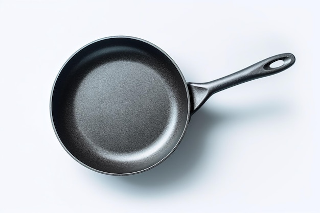 A black frying pan with a black handle and a white background.